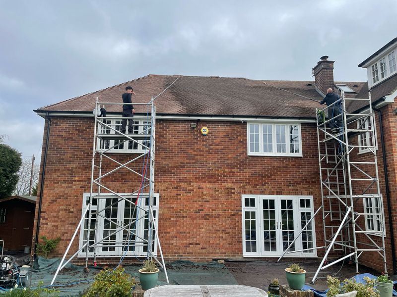 Roof cleaning carried out safely from scaffold towers by The Roof Moss Cleaners in Whittlesey